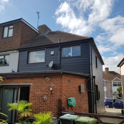 Double story House extension with anthracite cladding and dormer window